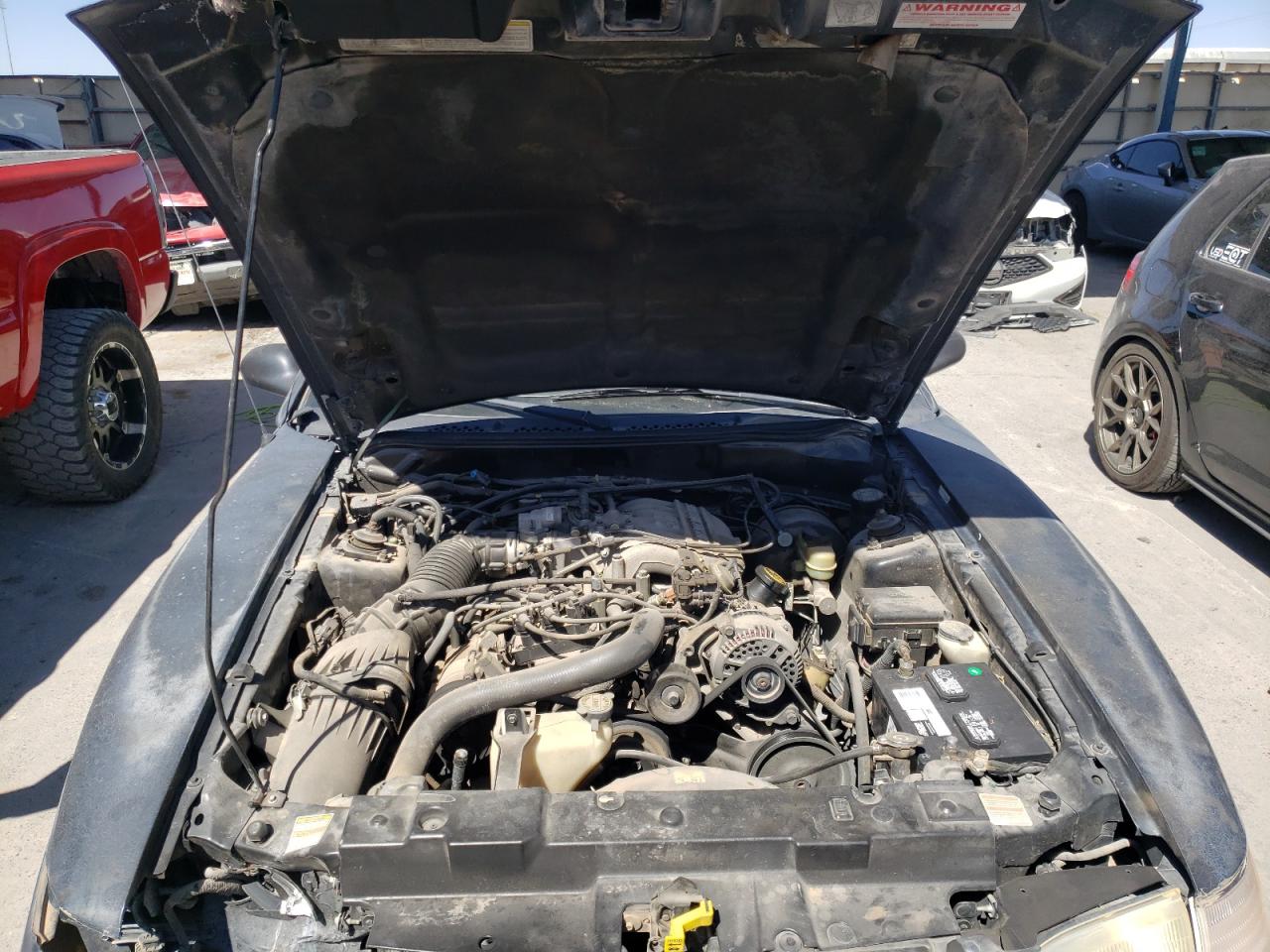 Photo 7 from auction – 1998 FORD MUSTANG with VIN 1FAFP4047WF231621