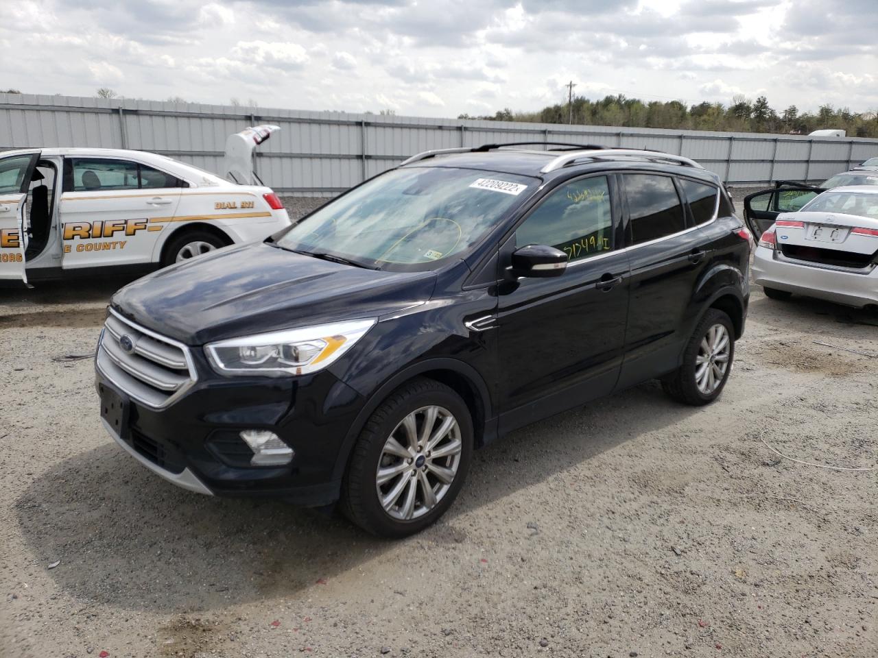 Photo 2 from auction – 2018 FORD ESCAPE TIT with VIN 1FMCU9J96JUA14607