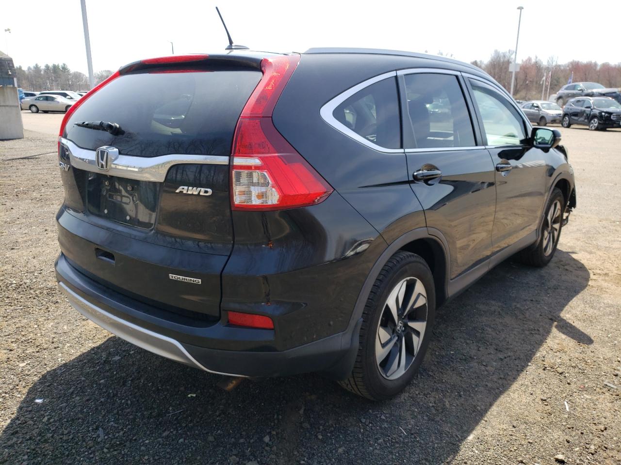 Photo 4 from auction – 2016 HONDA CR-V TOURI with VIN 5J6RM4H99GL076762
