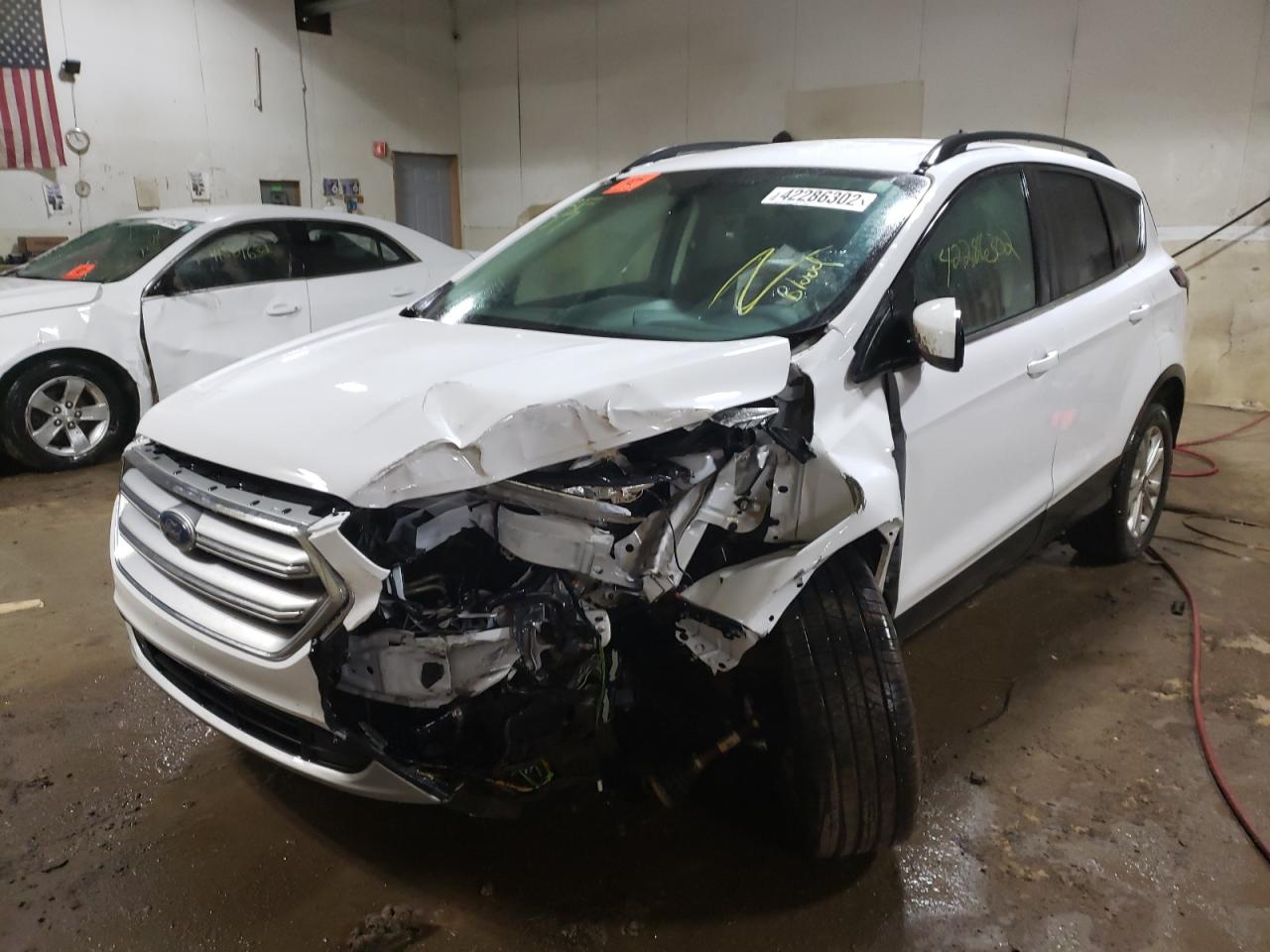 Photo 2 from auction – 2017 FORD ESCAPE SE with VIN 1FMCU9G91HUD92710