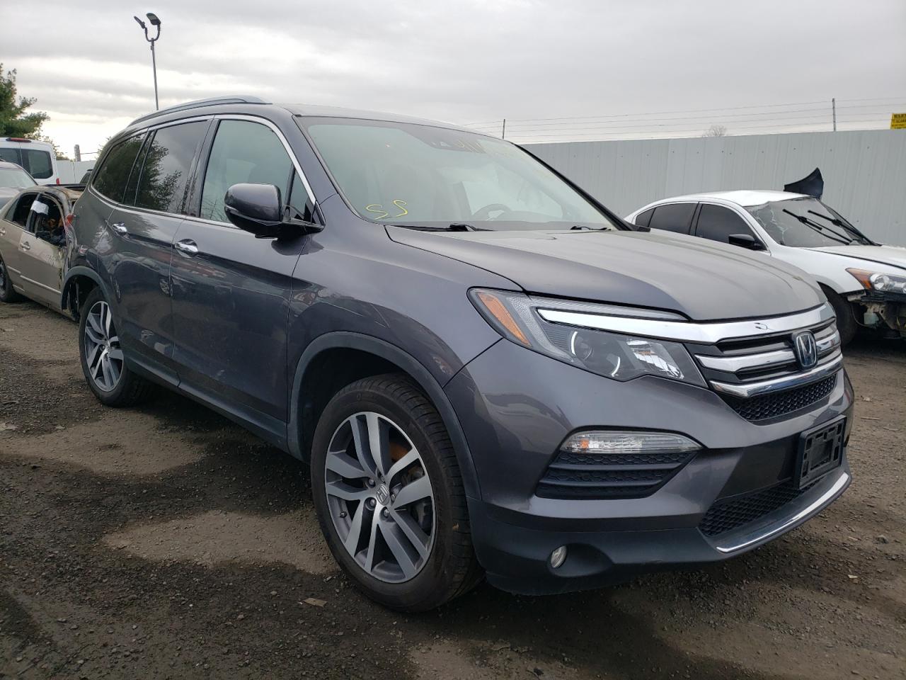 HONDA PILOT ELIT 2018 with VIN 5FNYF6H03JB002885 - Photo from auction