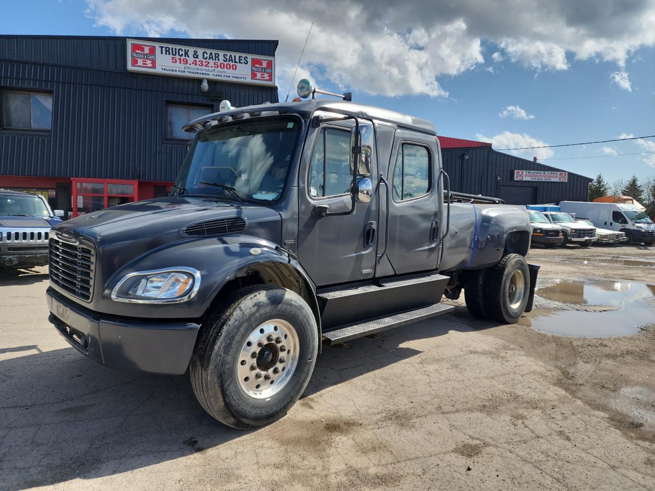 Photo 2 from auction – 2005 FREIGHTLINER M2 106 MED with VIN 1FVACYCS35HU12403