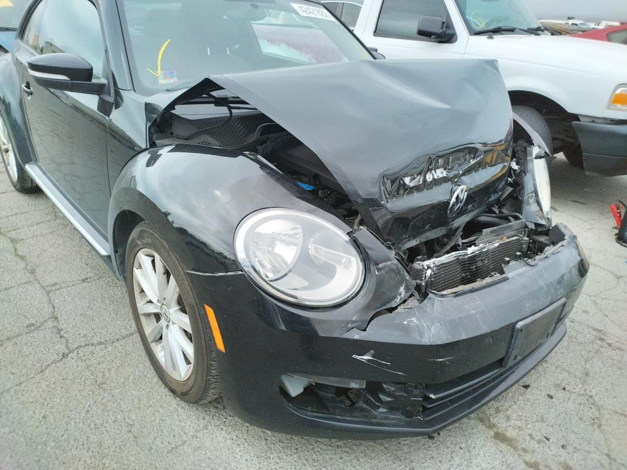 Photo 9 from auction – 2012 VOLKSWAGEN BEETLE with VIN 3VWJP7AT0CM646039