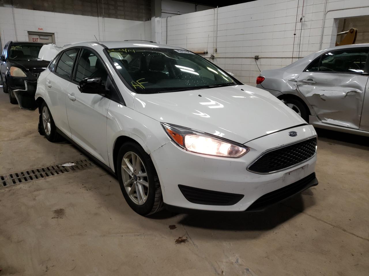 FORD FOCUS SE 2016 with VIN 1FADP3F21GL227218 - Photo from auction