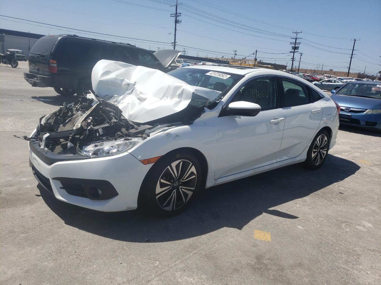 Photo 2 from auction – 2016 HONDA CIVIC EX with VIN 2HGFC1F32GH640291
