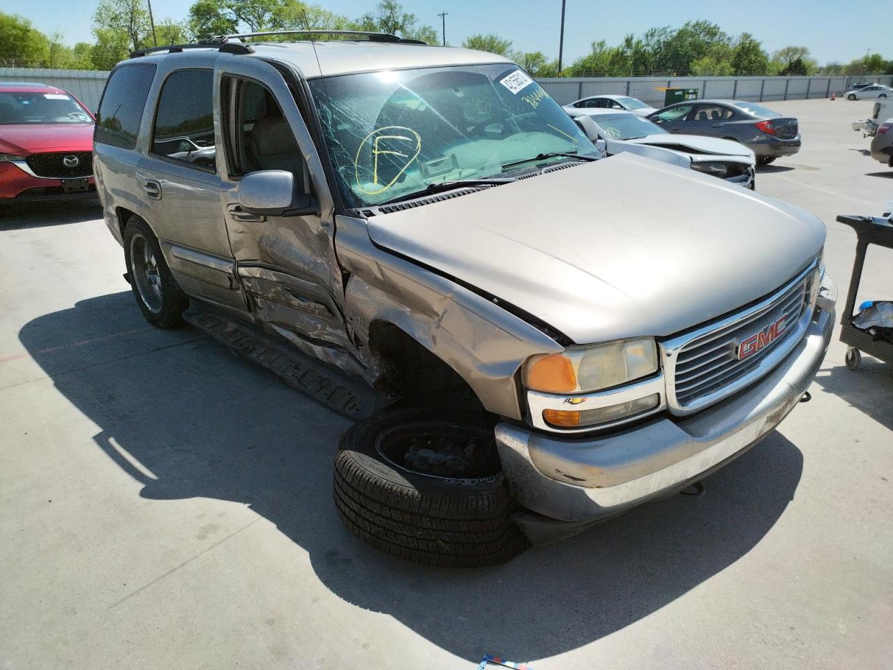 GMC YUKON 2002 with VIN 1GKEC13V02R324448 - Photo from auction
