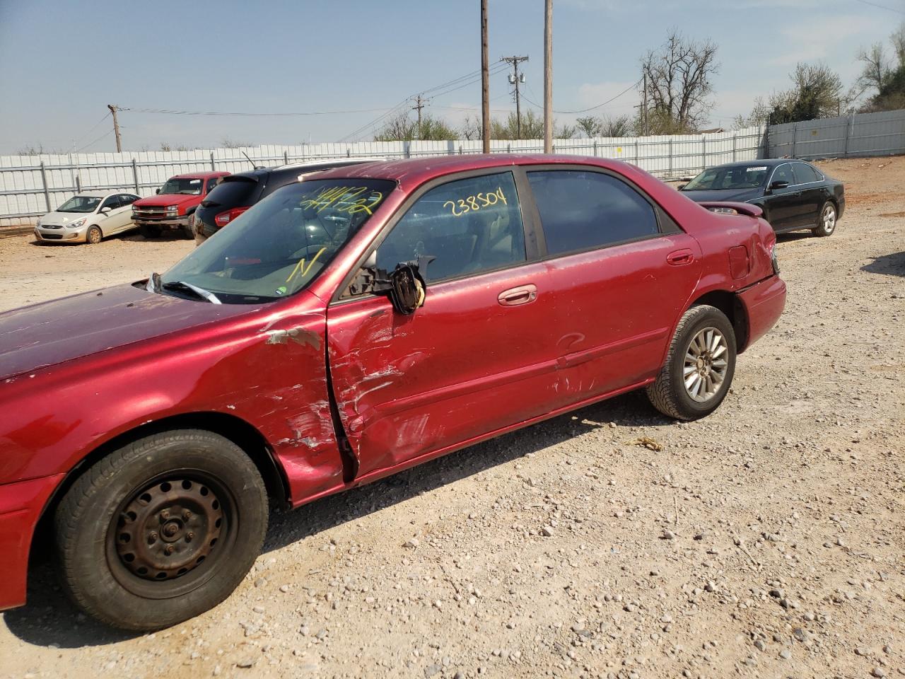 Photo 9 from auction – 1998 MAZDA 626 DX with VIN 1YVGF22C0W5704978