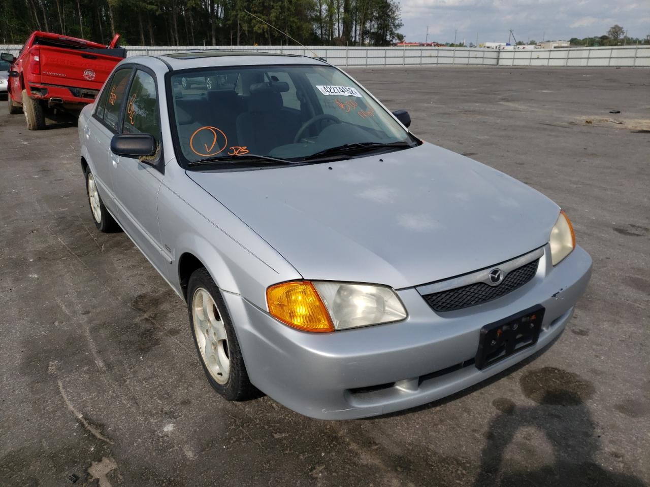 MAZDA PROTEGE 2001 with VIN JM1BJ2211Y0250057 - Photo from auction