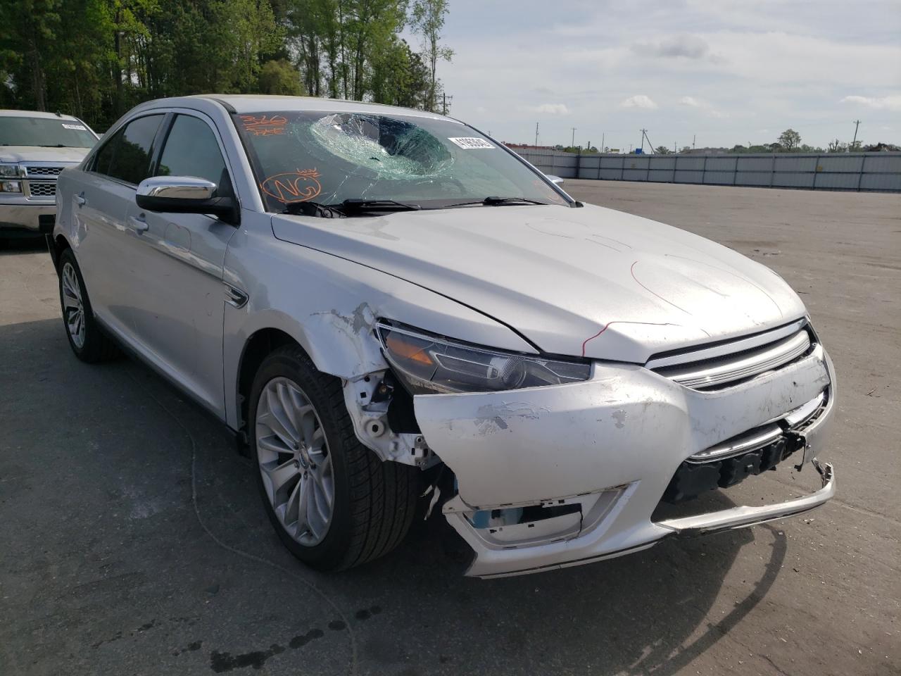 FORD TAURUS LIM 2014 with VIN 1FAHP2F8XEG179644 - Photo from auction
