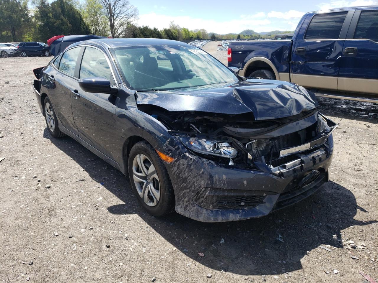 HONDA CIVIC LX 2018 with VIN 19XFC2E55JE011196 - Photo from auction