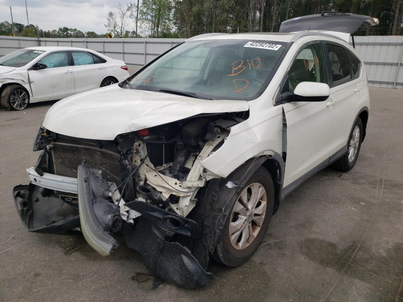 Photo 2 from auction – 2012 HONDA CR-V EXL with VIN 5J6RM3H79CL009792