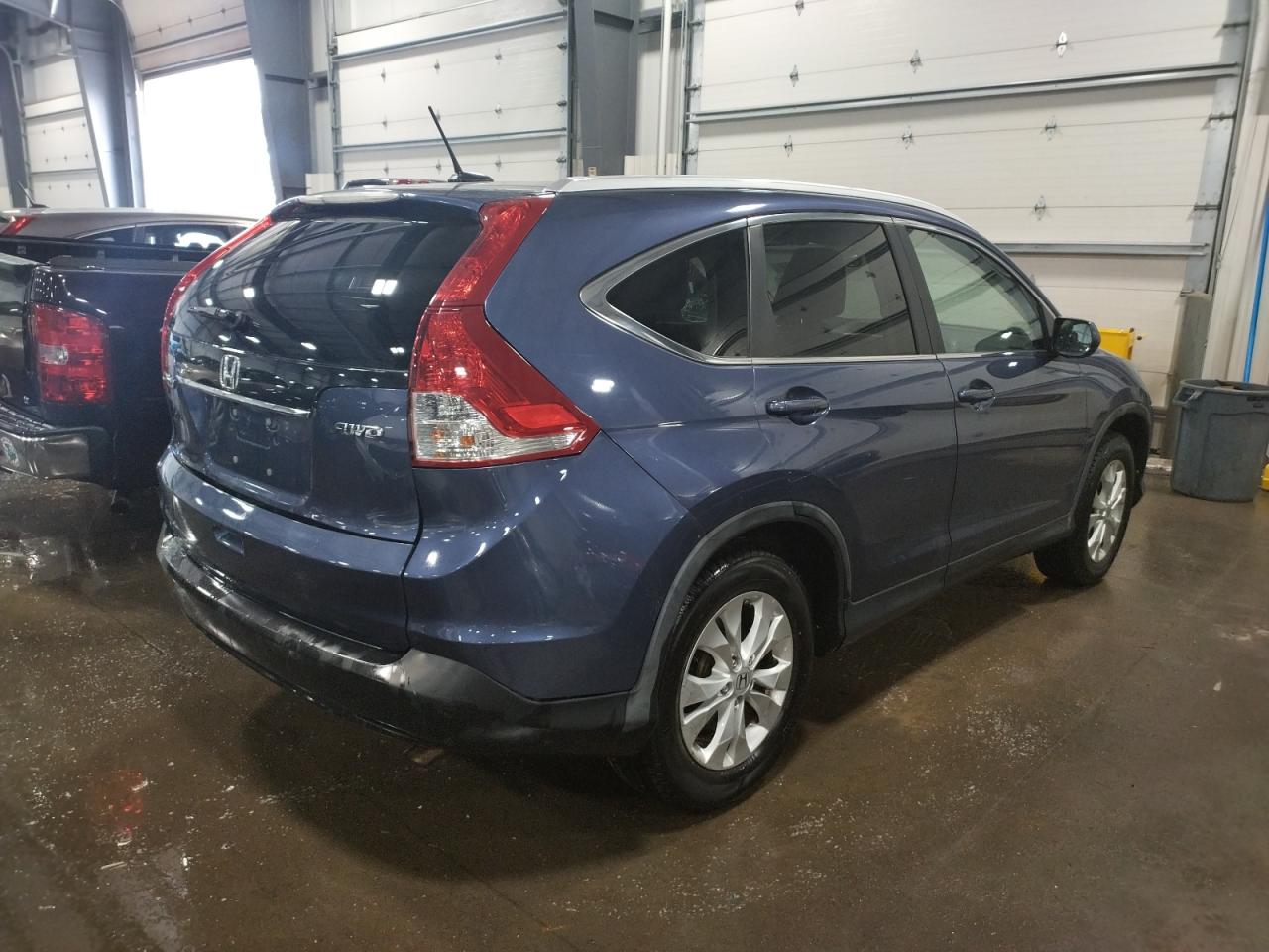 Photo 4 from auction – 2012 HONDA CR-V EXL with VIN 5J6RM4H73CL014976