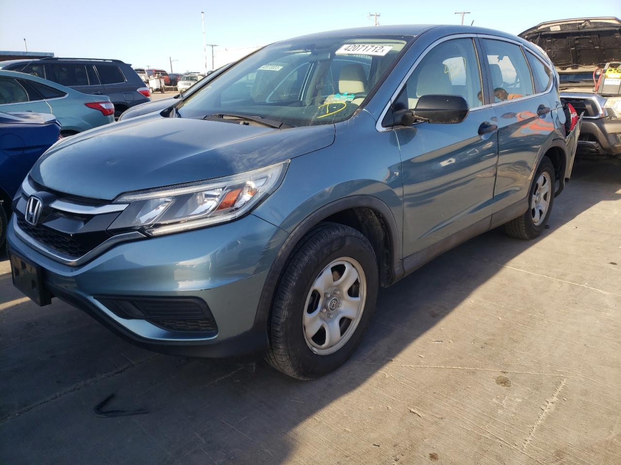 Photo 2 from auction – 2015 HONDA CR-V LX with VIN 2HKRM3H37FH559875