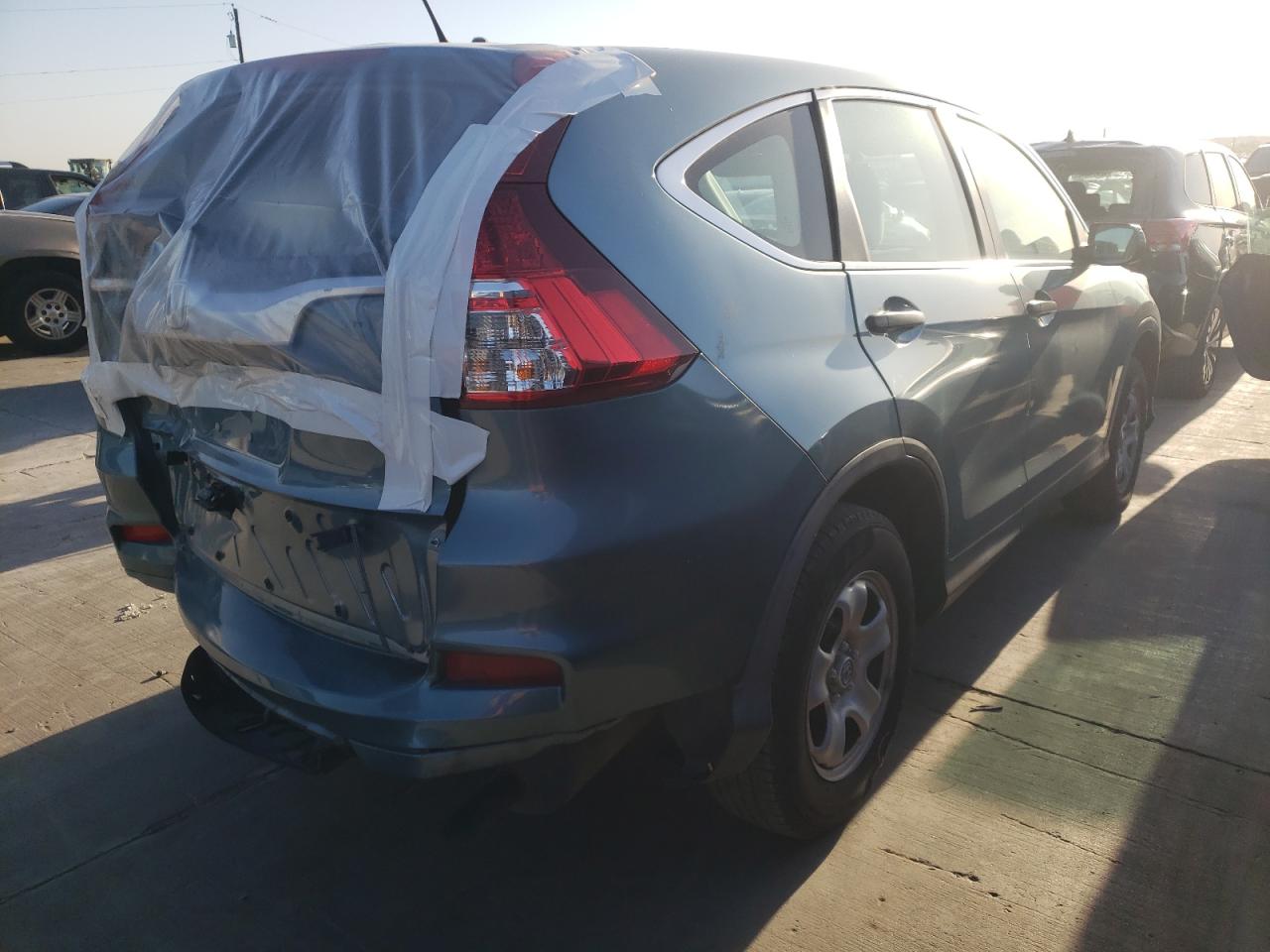 Photo 4 from auction – 2015 HONDA CR-V LX with VIN 2HKRM3H37FH559875