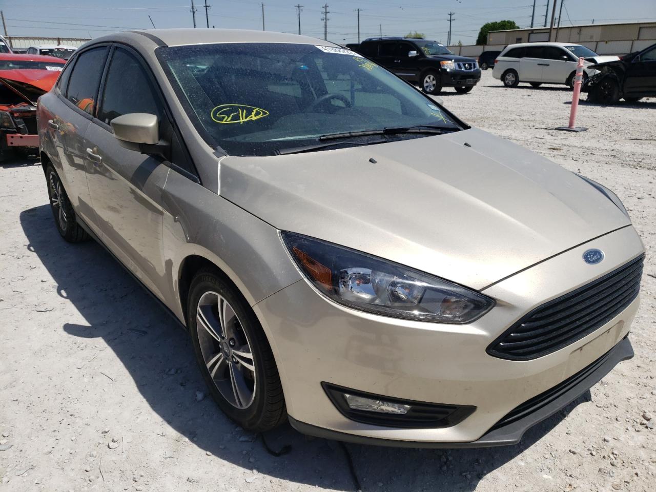 FORD FOCUS SE 2018 with VIN 1FADP3FE1JL203938 - Photo from auction