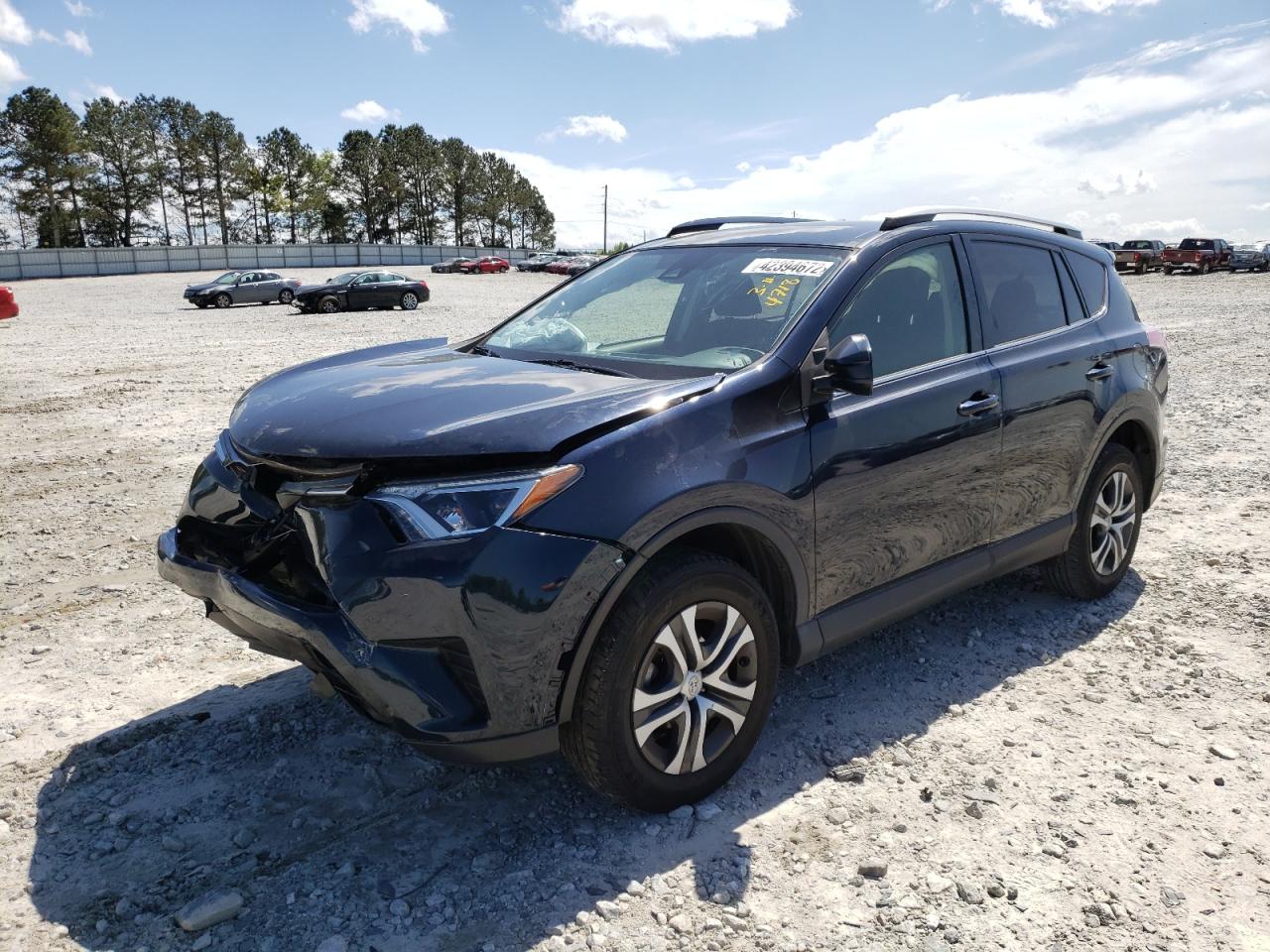 Photo 2 from auction – 2017 TOYOTA RAV4 LE with VIN JTMZFREV2HJ144718