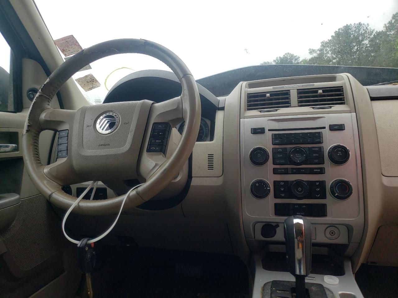 Photo 9 from auction – 2009 MERCURY MARINER with VIN 4M2CU81709KJ00705