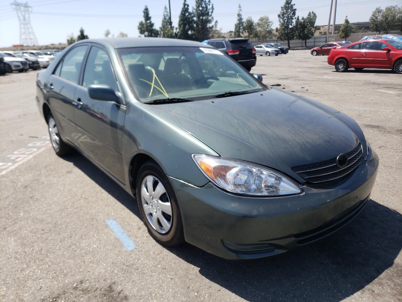TOYOTA CAMRY LE 2002 with VIN JTDBE32K220114904 - Photo from auction