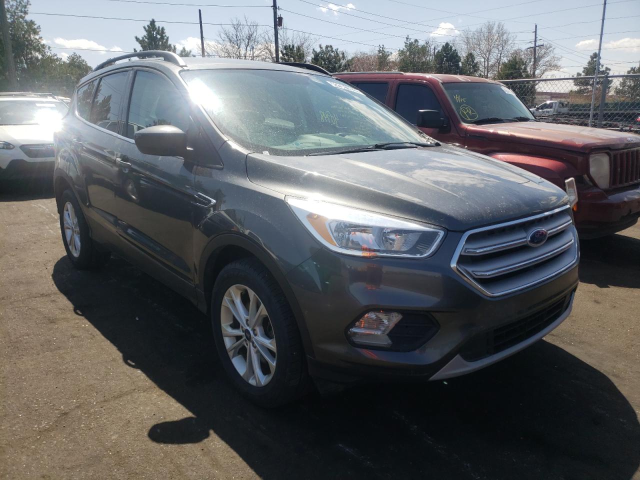 FORD ESCAPE SE 2018 with VIN 1FMCU9GD2JUB70610 - Photo from auction