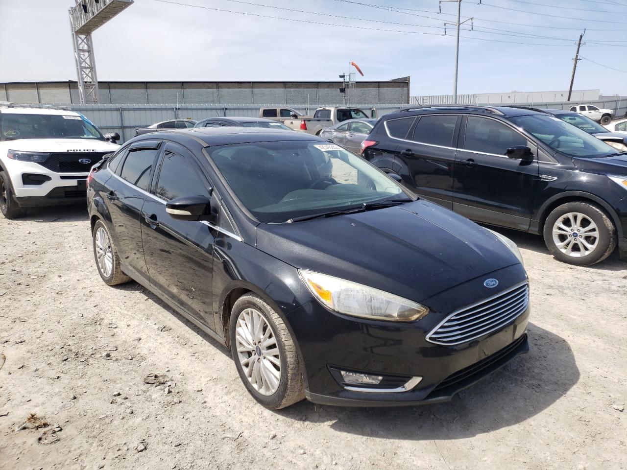FORD FOCUS TITA 2015 with VIN 1FADP3J2XFL293059 - Photo from auction