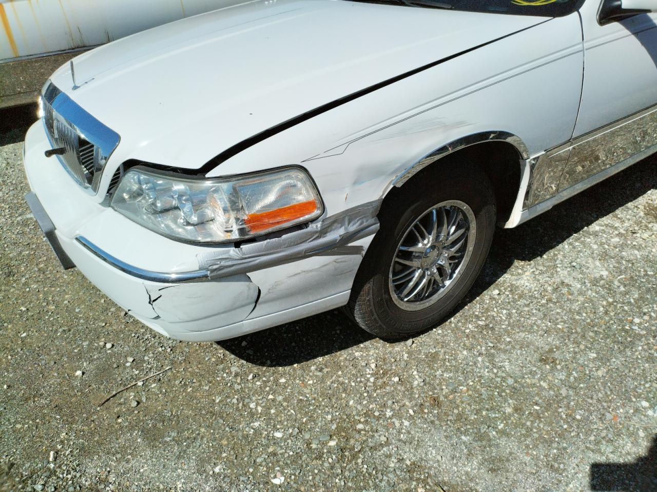 Photo 9 from auction – 2000 LINCOLN TOWN CAR E with VIN 1L1FM81W0YY825594