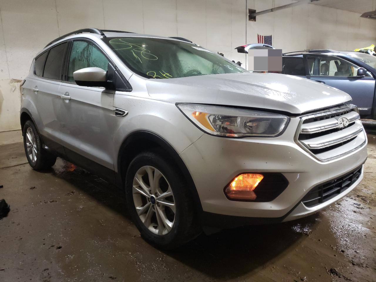 FORD ESCAPE SE 2018 with VIN 1FMCU9GD9JUC13310 - Photo from auction