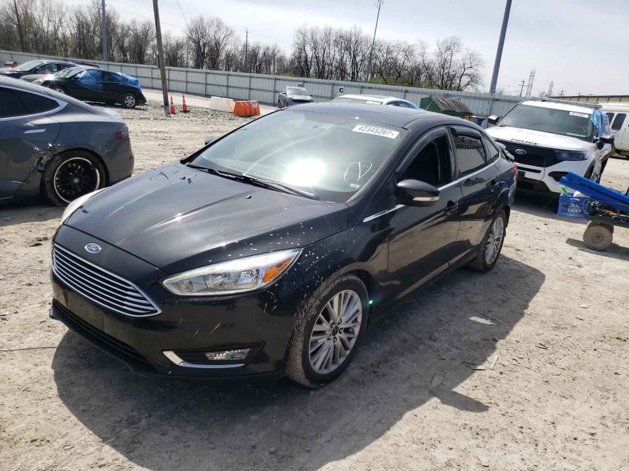 Photo 2 from auction – 2015 FORD FOCUS TITA with VIN 1FADP3J2XFL293059