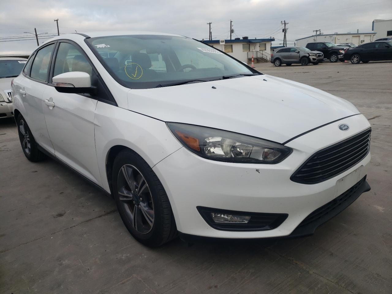 FORD FOCUS SE 2016 with VIN 1FADP3FE7GL225094 - Photo from auction