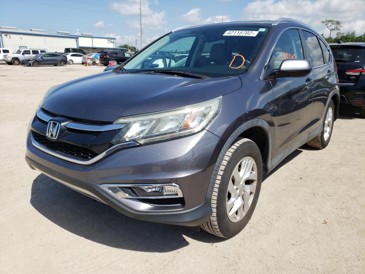 Photo 2 from auction – 2015 HONDA CR-V EXL with VIN 2HKRM4H74FH707182