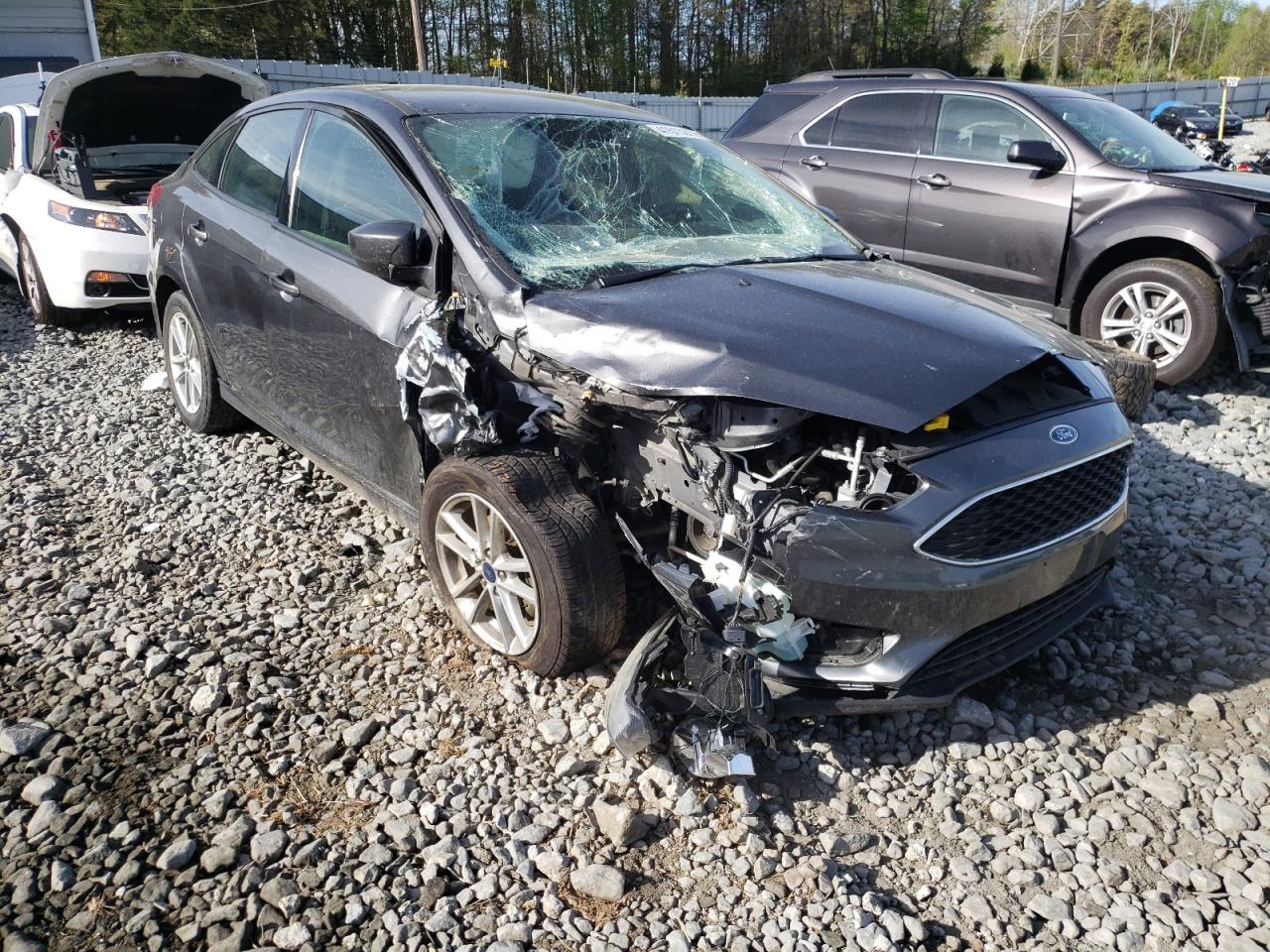 FORD FOCUS SE 2018 with VIN 1FADP3F26JL276048 - Photo from auction