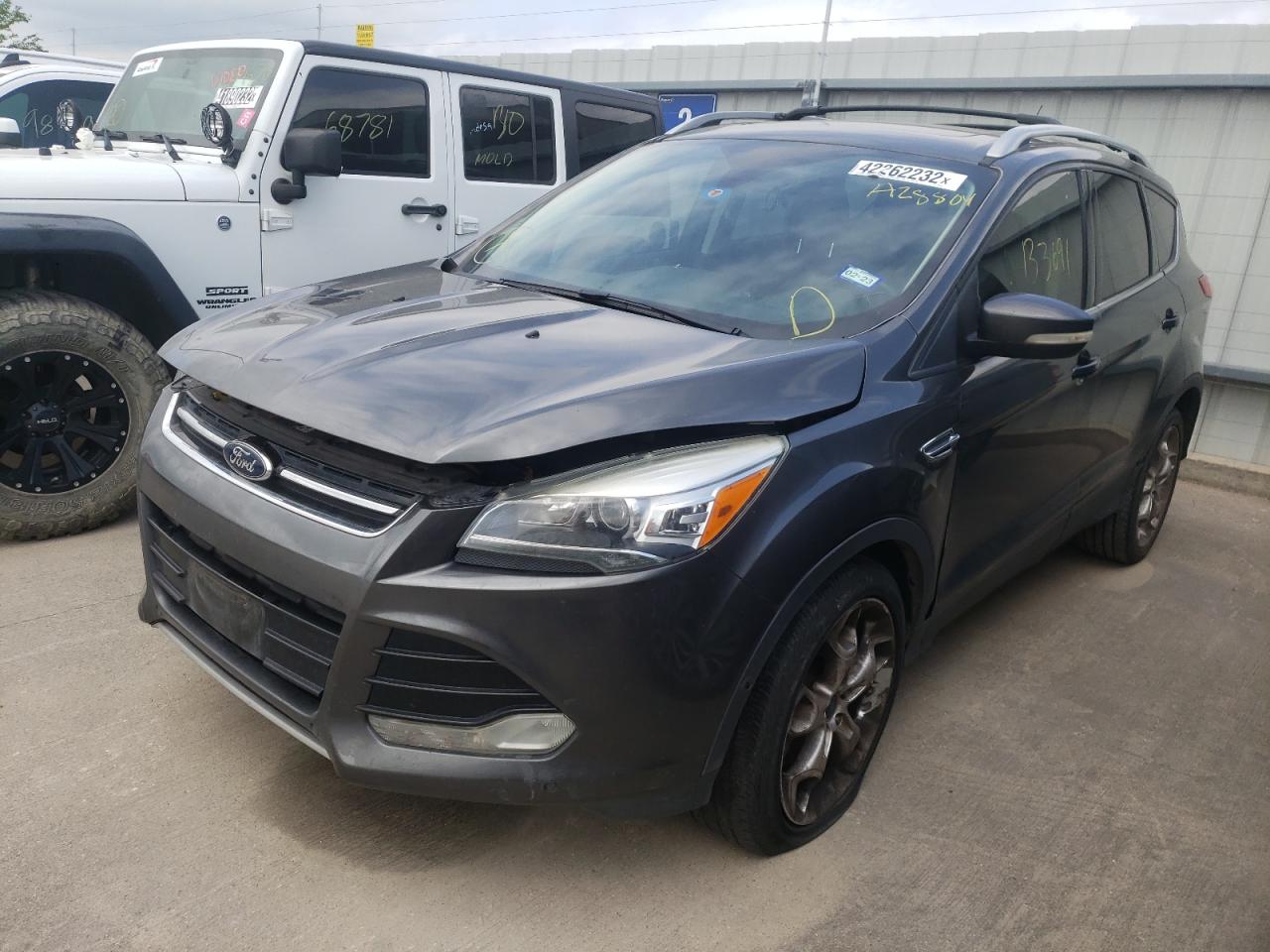 Photo 2 from auction – 2016 FORD ESCAPE TIT with VIN 1FMCU0J96GUA28804