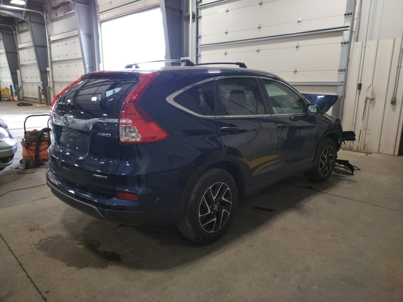 Photo 4 from auction – 2016 HONDA CR-V SE with VIN 5J6RM4H4XGL045749