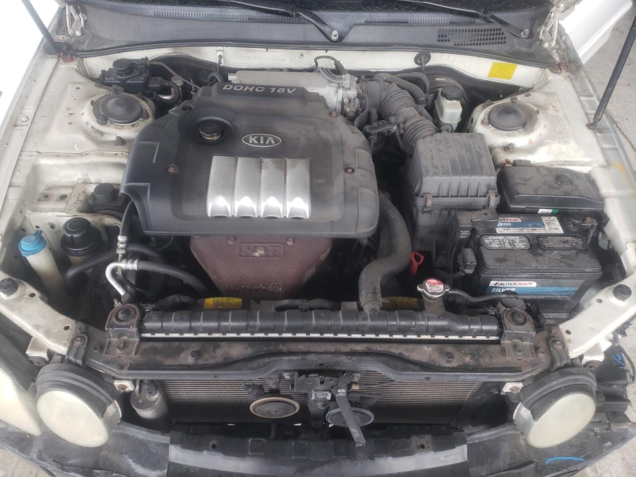 Photo 7 from auction – 2004 KIA OPTIMA LX with VIN KNAGD126445342874