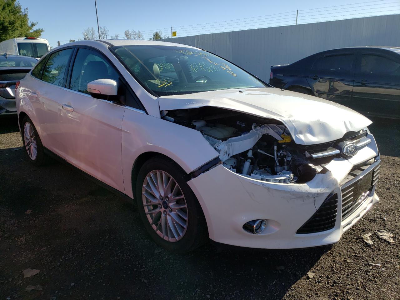 FORD FOCUS TITA 2014 with VIN 1FADP3J2XEL386355 - Photo from auction