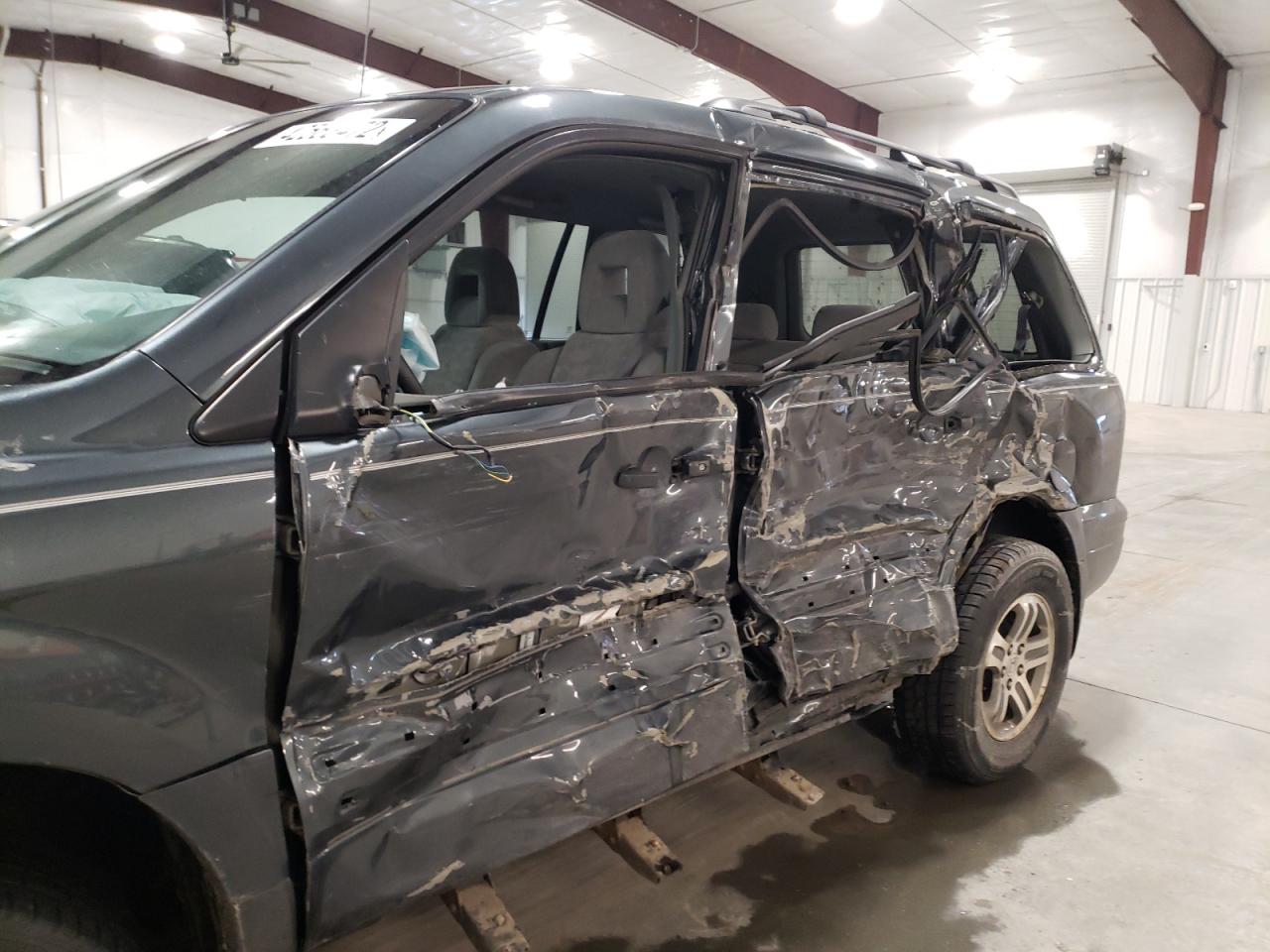 Photo 9 from auction – 2004 HONDA PILOT EX with VIN 2HKYF18404H514423