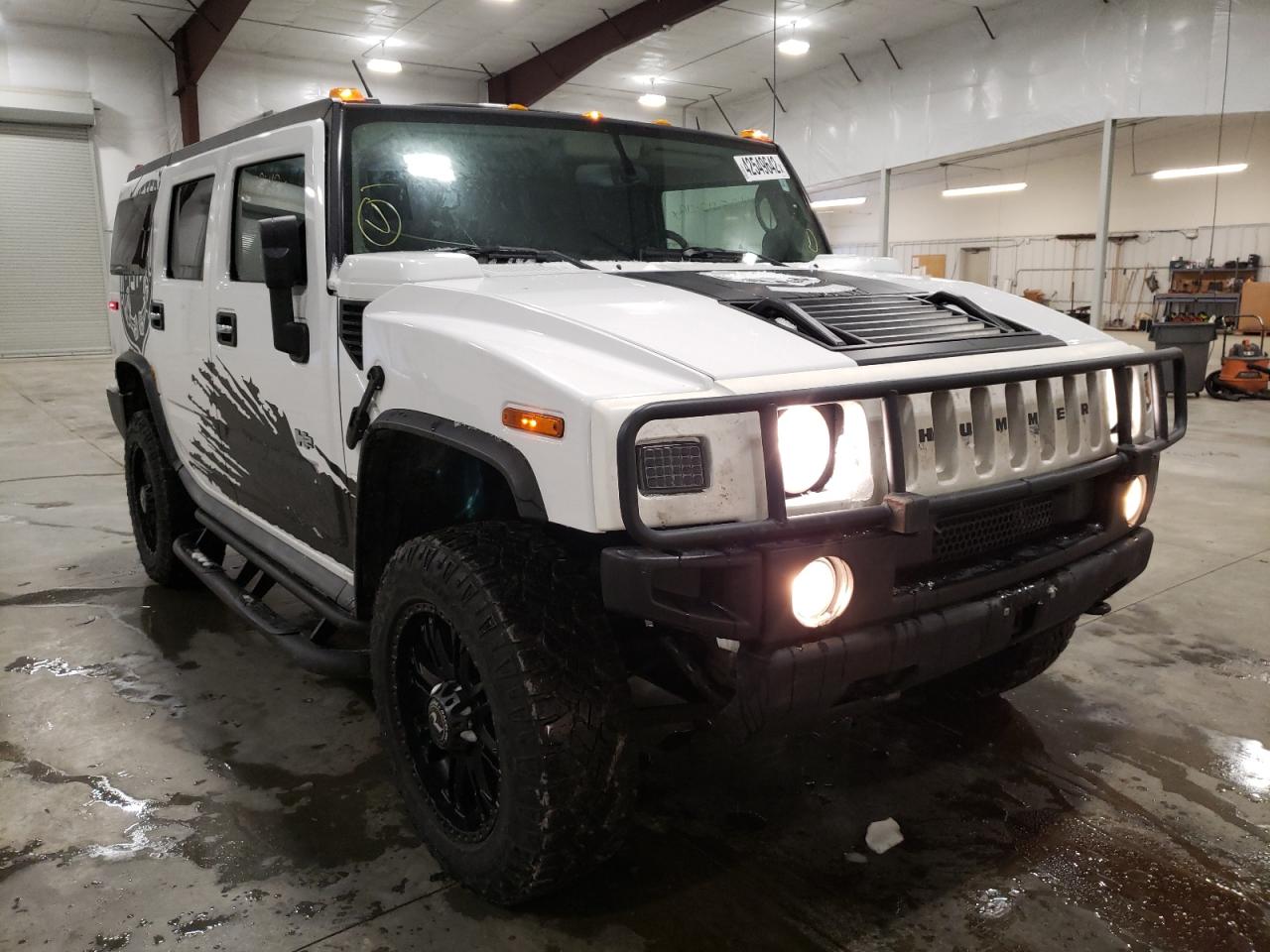 HUMMER H2 2003 with VIN 5GRGN23U13H147734 - Photo from auction