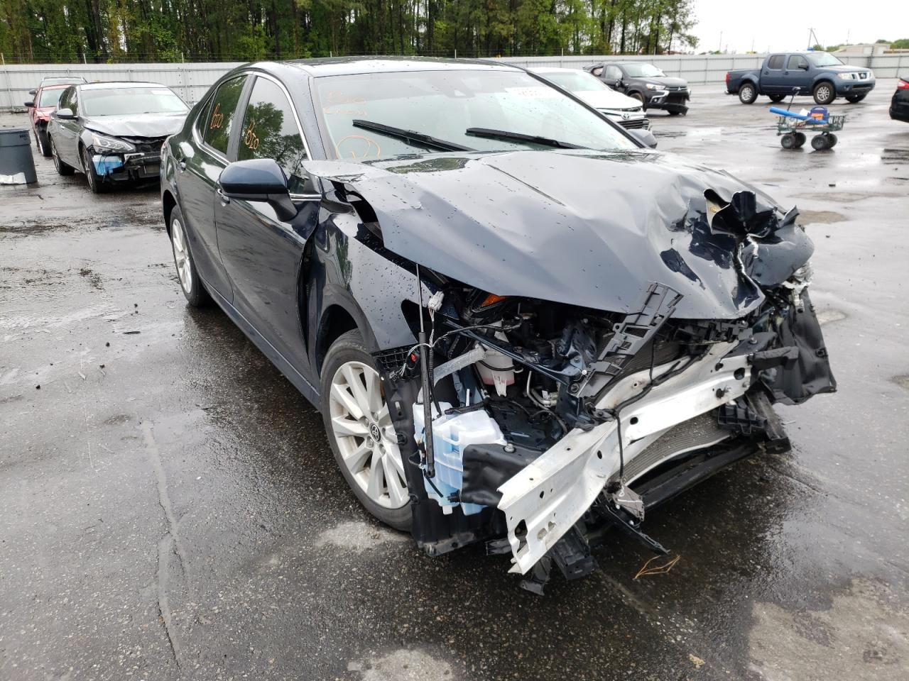 TOYOTA CAMRY LE 2020 with VIN 4T1C11AK2LU977004 - Photo from auction