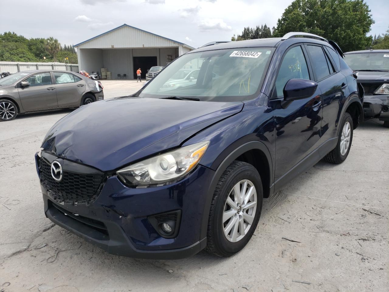 Photo 2 from auction – 2014 MAZDA CX-5 TOURI with VIN JM3KE2CYXE0331979