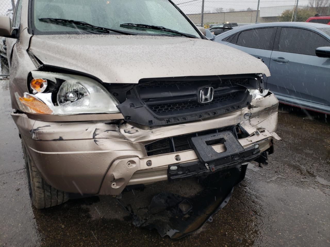 Photo 9 from auction – 2004 HONDA PILOT EX with VIN 2HKYF18484H580900