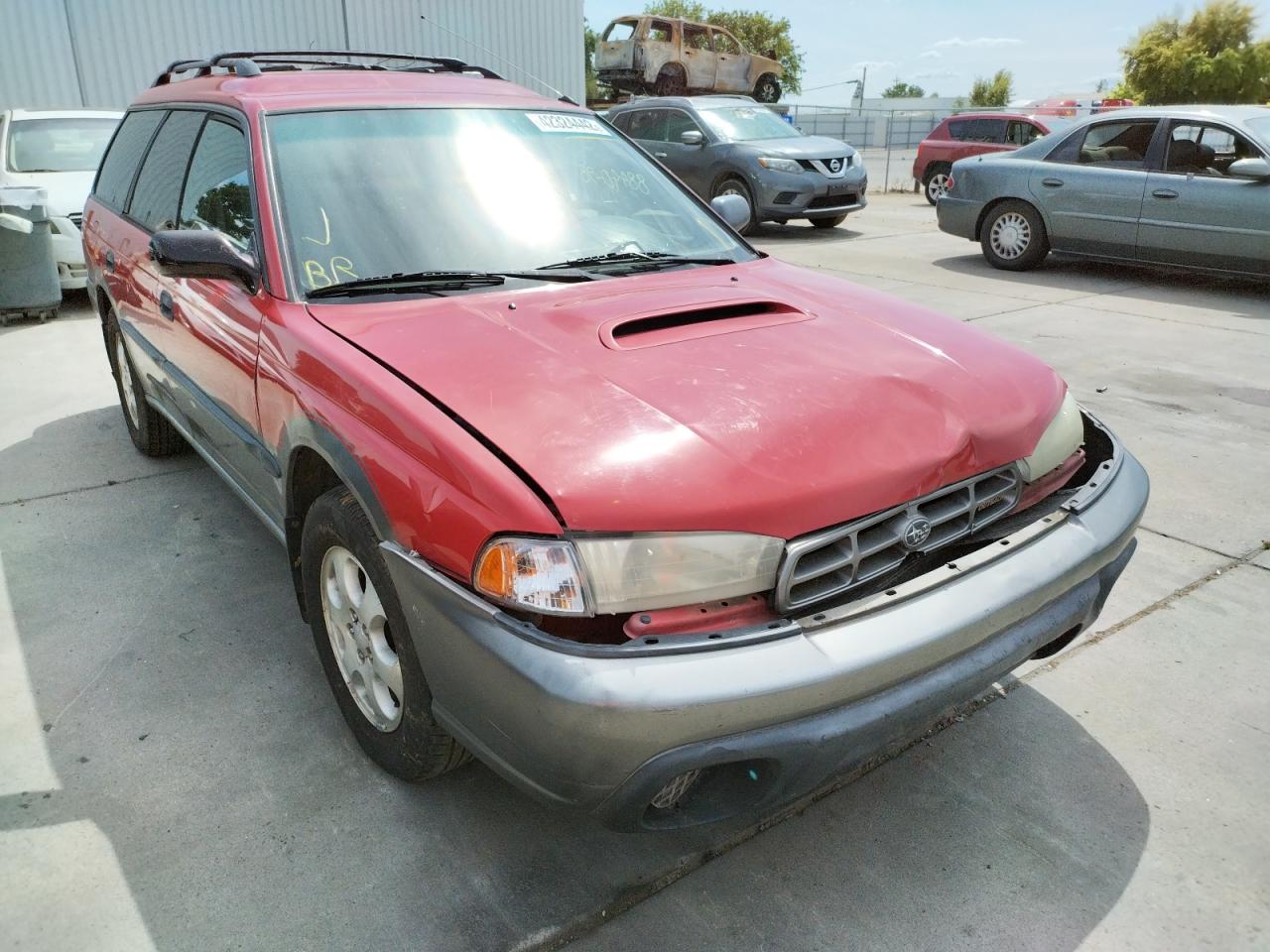 SUBARU LEGACY OUT 1999 with VIN 4S3BG6855X7616706 - Photo from auction