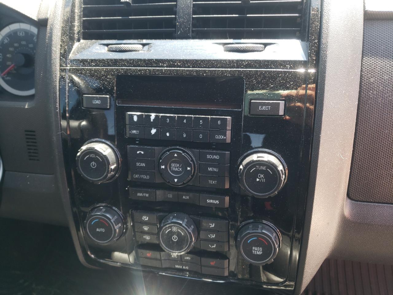 Photo 9 from auction – 2009 FORD ESCAPE LIM with VIN 1FMCU04739KB34197