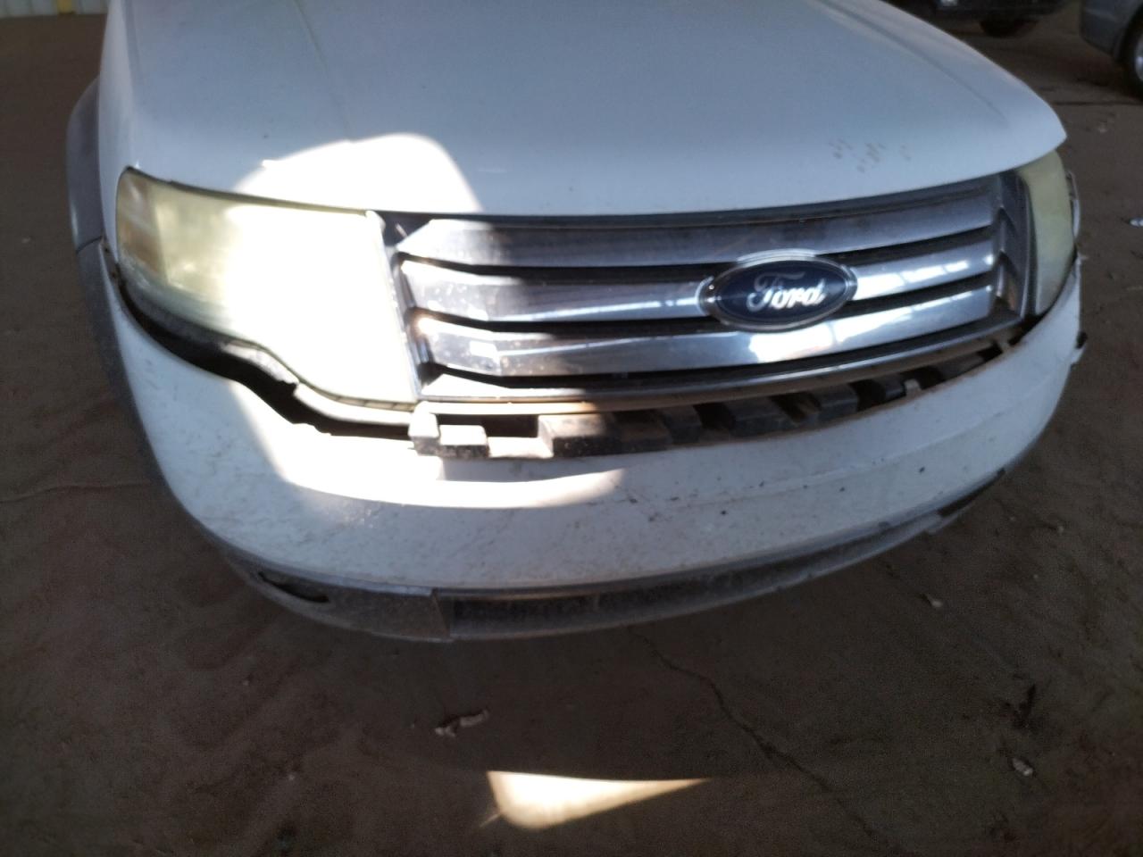 Photo 9 from auction – 2008 FORD TAURUS X S with VIN 1FMDK02W48GA10347