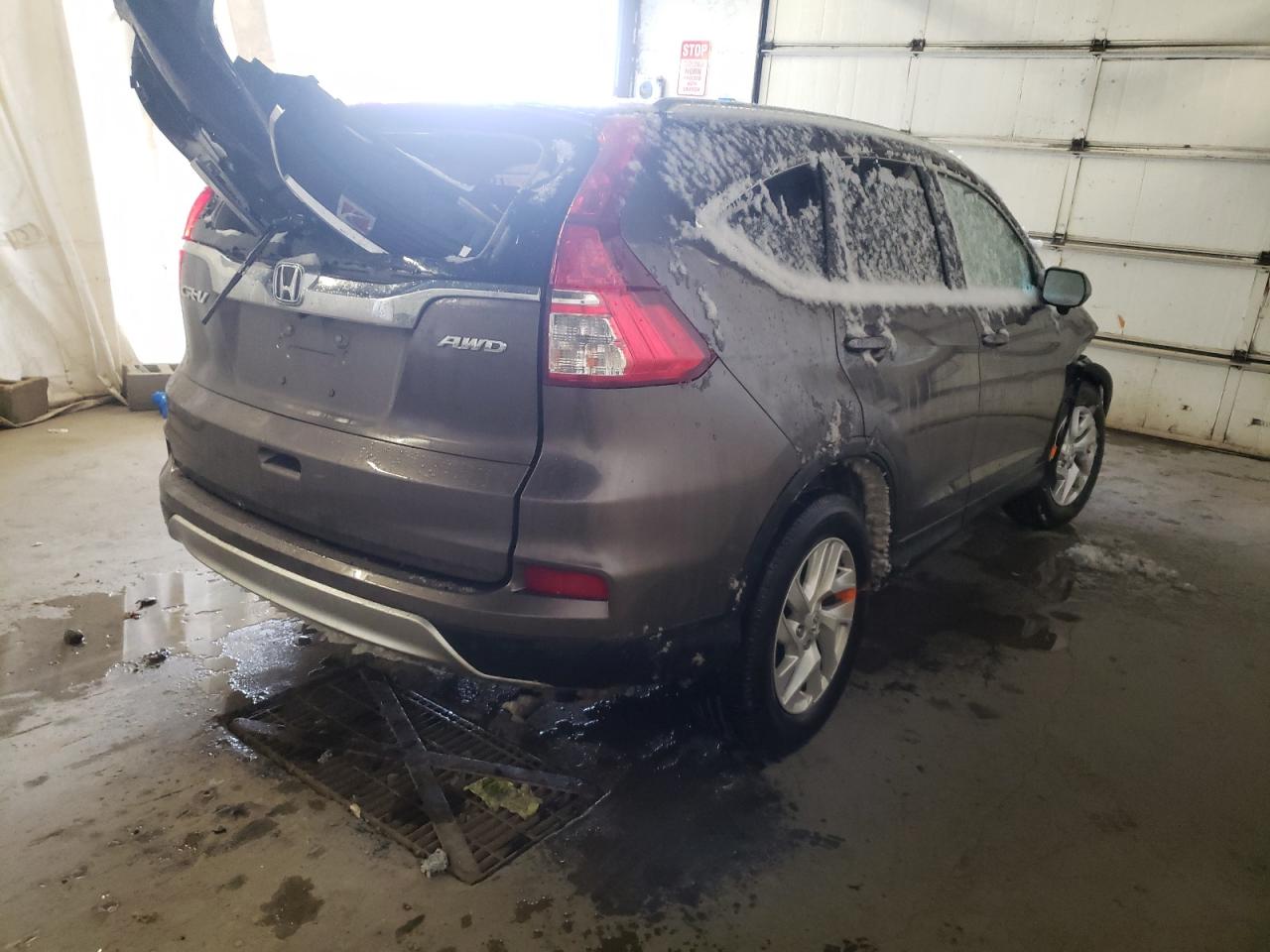 Photo 4 from auction – 2016 HONDA CR-V EXL with VIN 2HKRM4H79GH694298