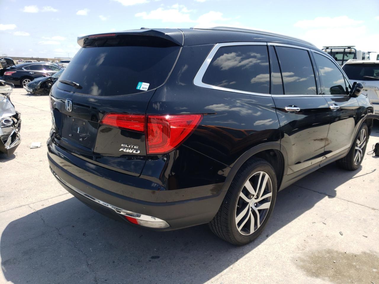 Photo 4 from auction – 2016 HONDA PILOT ELIT with VIN 5FNYF6H05GB117240