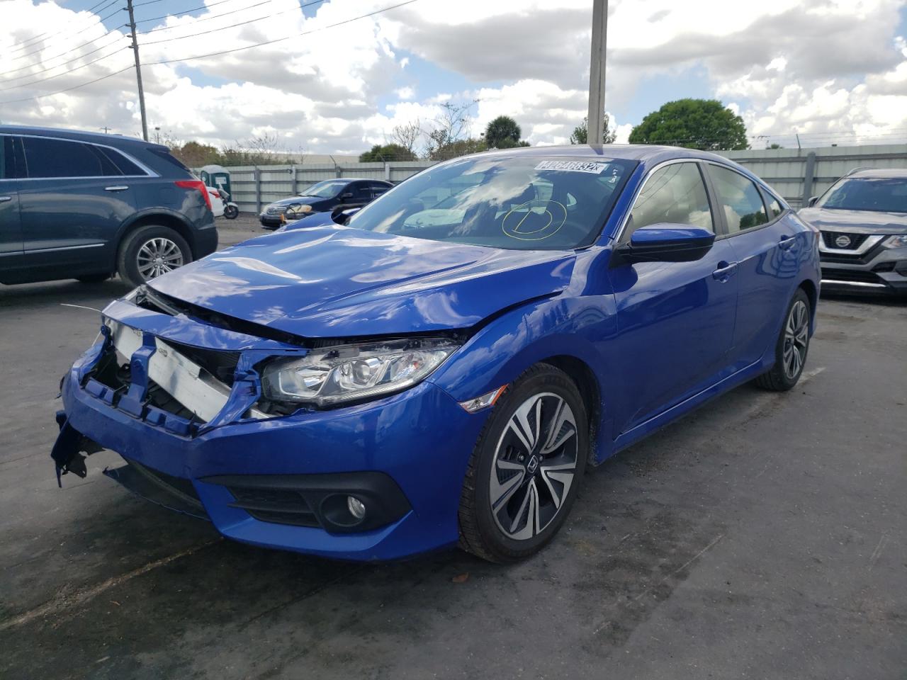 Photo 2 from auction – 2018 HONDA CIVIC EX with VIN JHMFC1F36JX030314