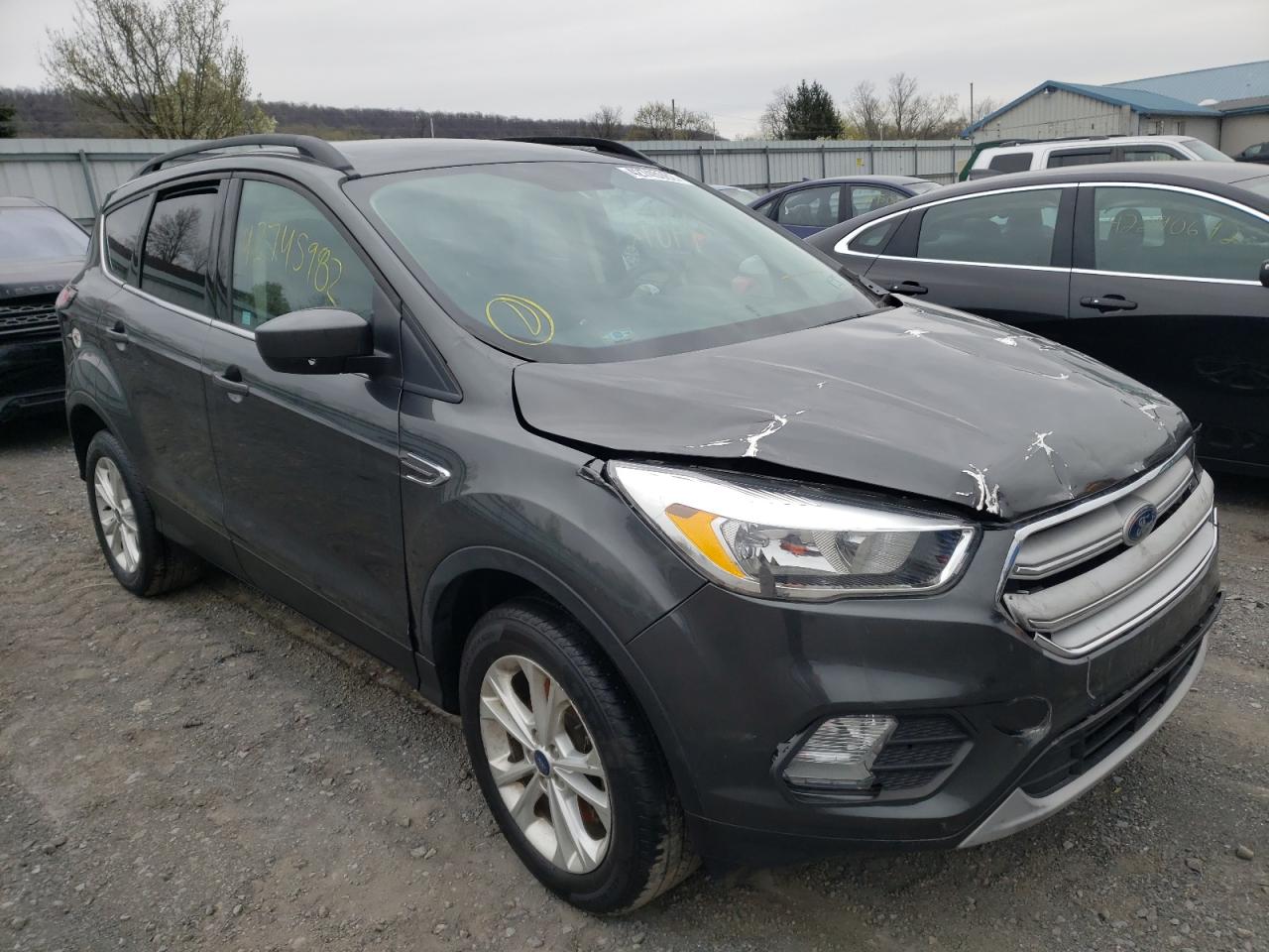 FORD ESCAPE SE 2018 with VIN 1FMCU9GDXJUB02779 - Photo from auction