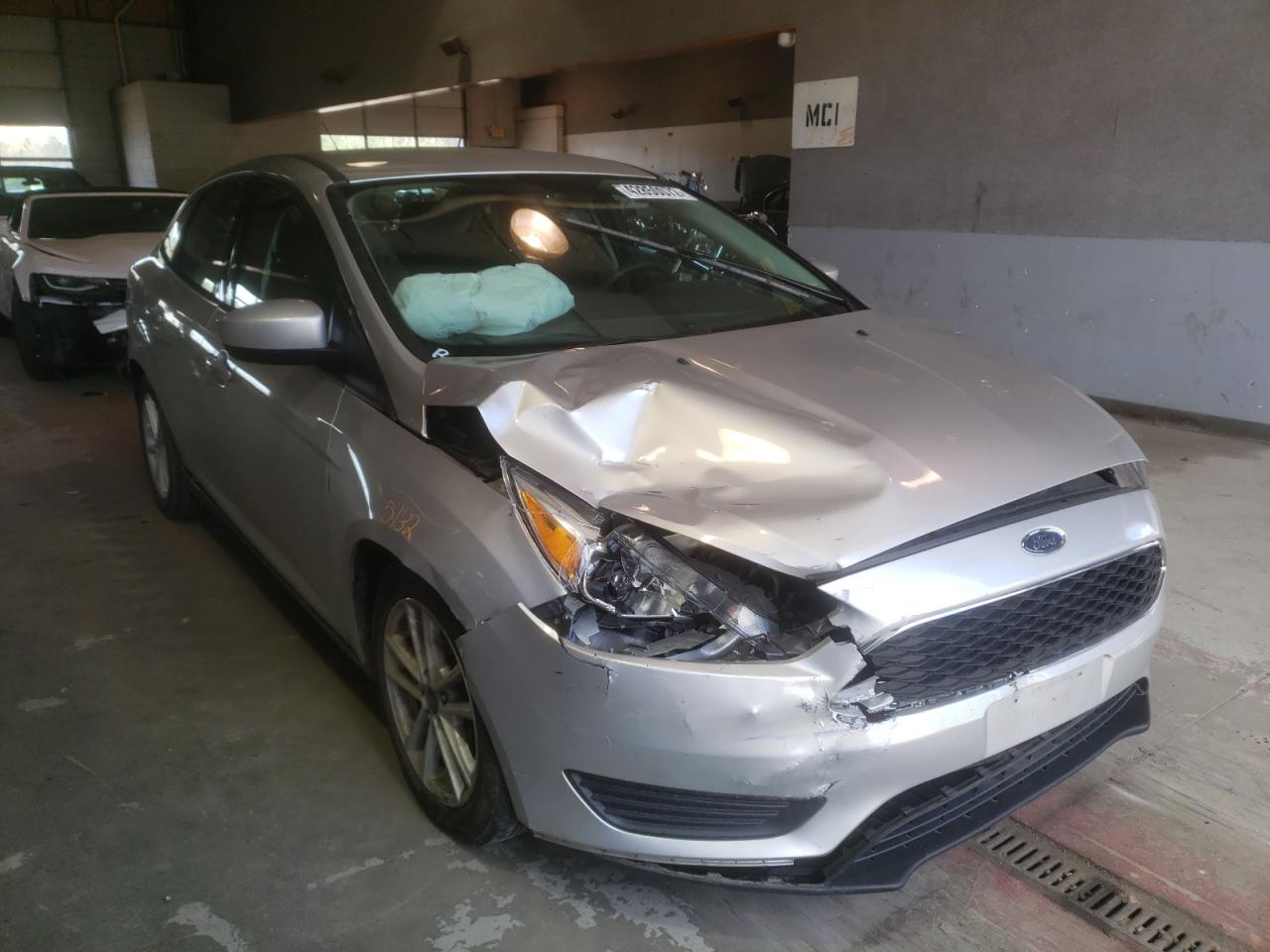 FORD FOCUS SE 2018 with VIN 1FADP3F20JL215102 - Photo from auction