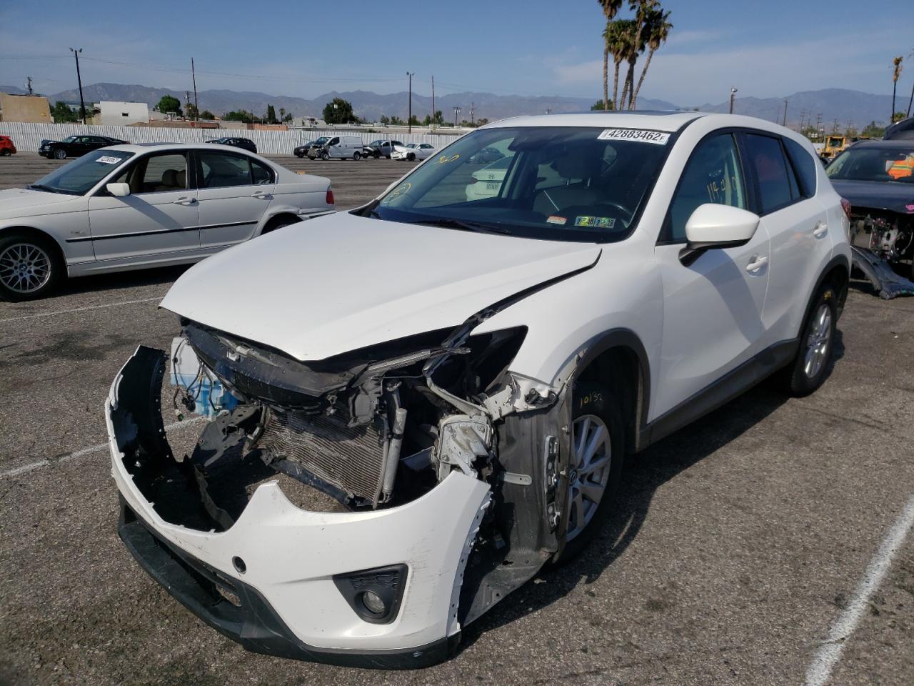 Photo 2 from auction – 2014 MAZDA CX-5 TOURI with VIN JM3KE4CY9E0393305