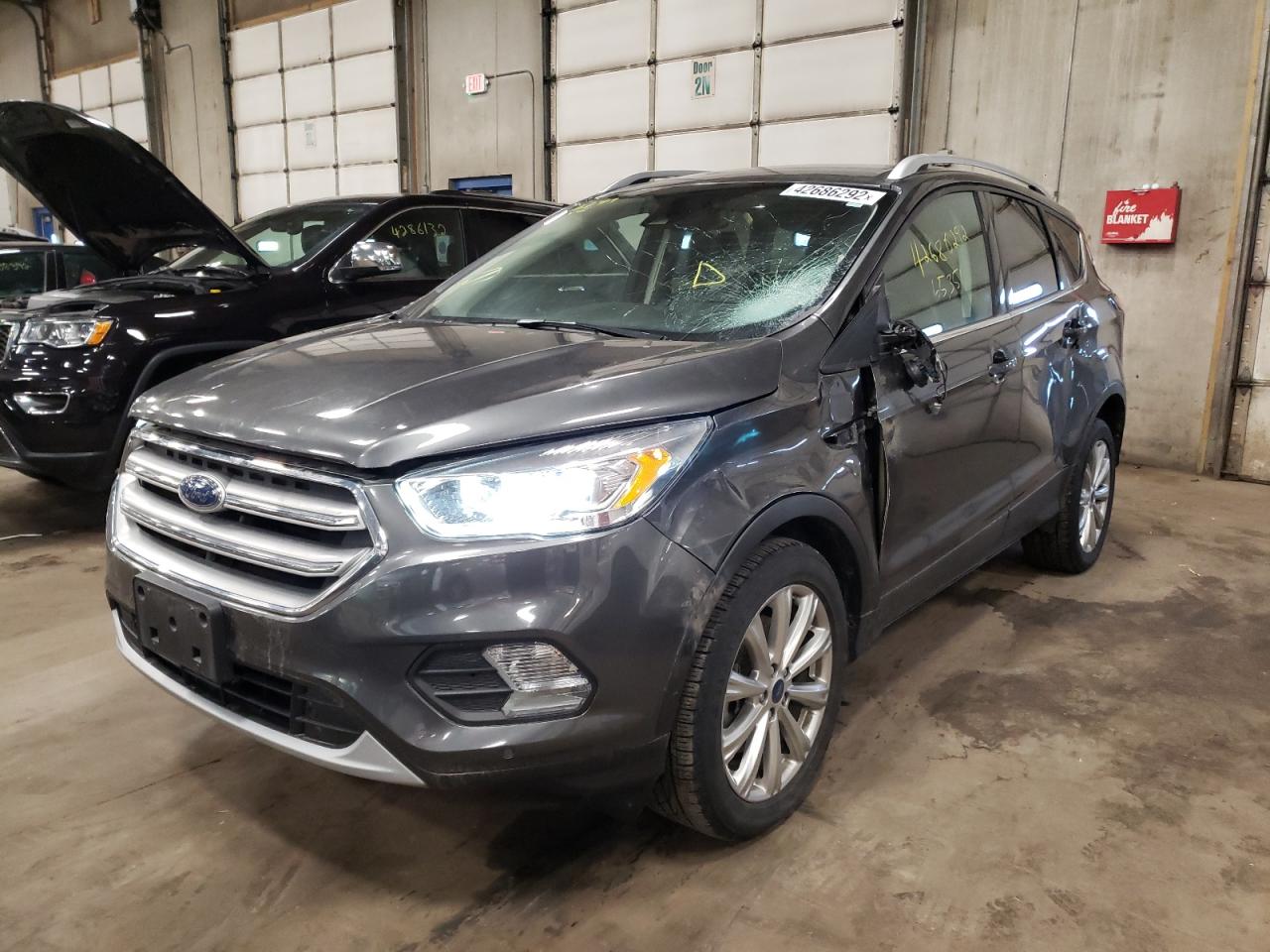 Photo 2 from auction – 2017 FORD ESCAPE TIT with VIN 1FMCU9JD5HUC82174