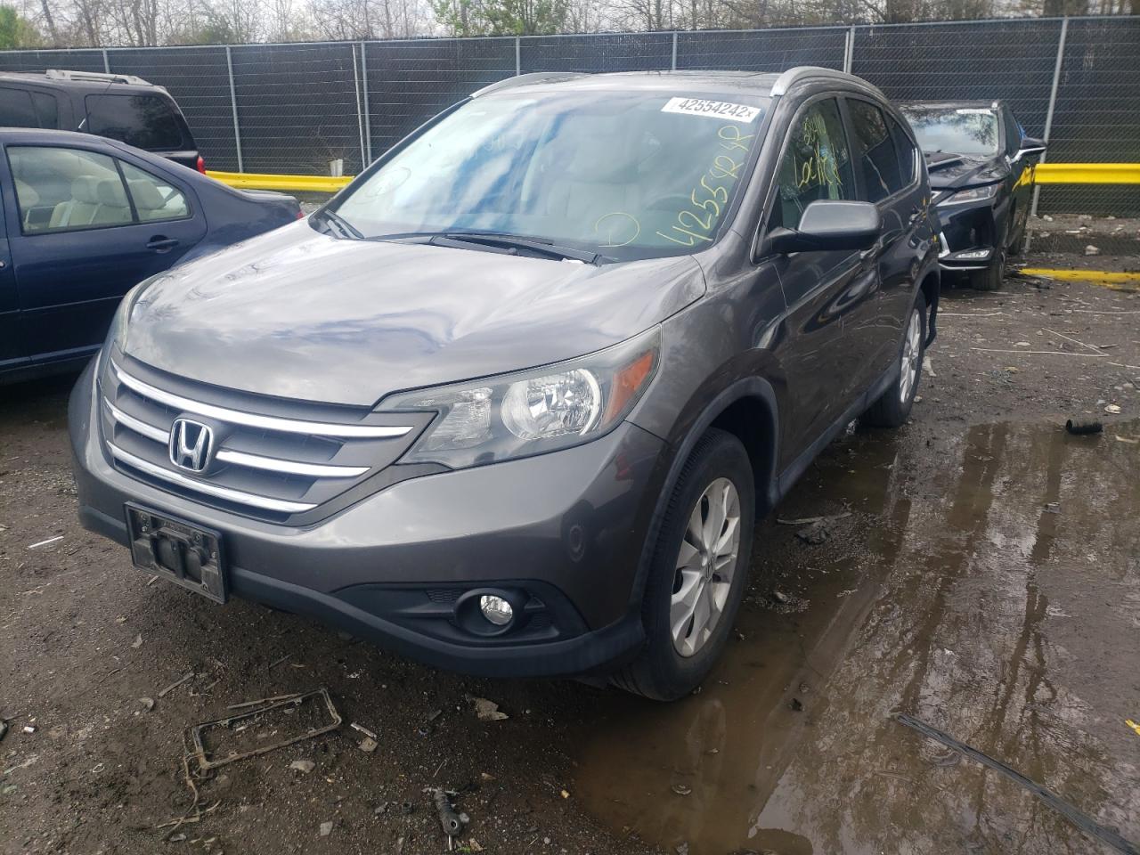 Photo 2 from auction – 2014 HONDA CR-V EXL with VIN 2HKRM4H73EH671449